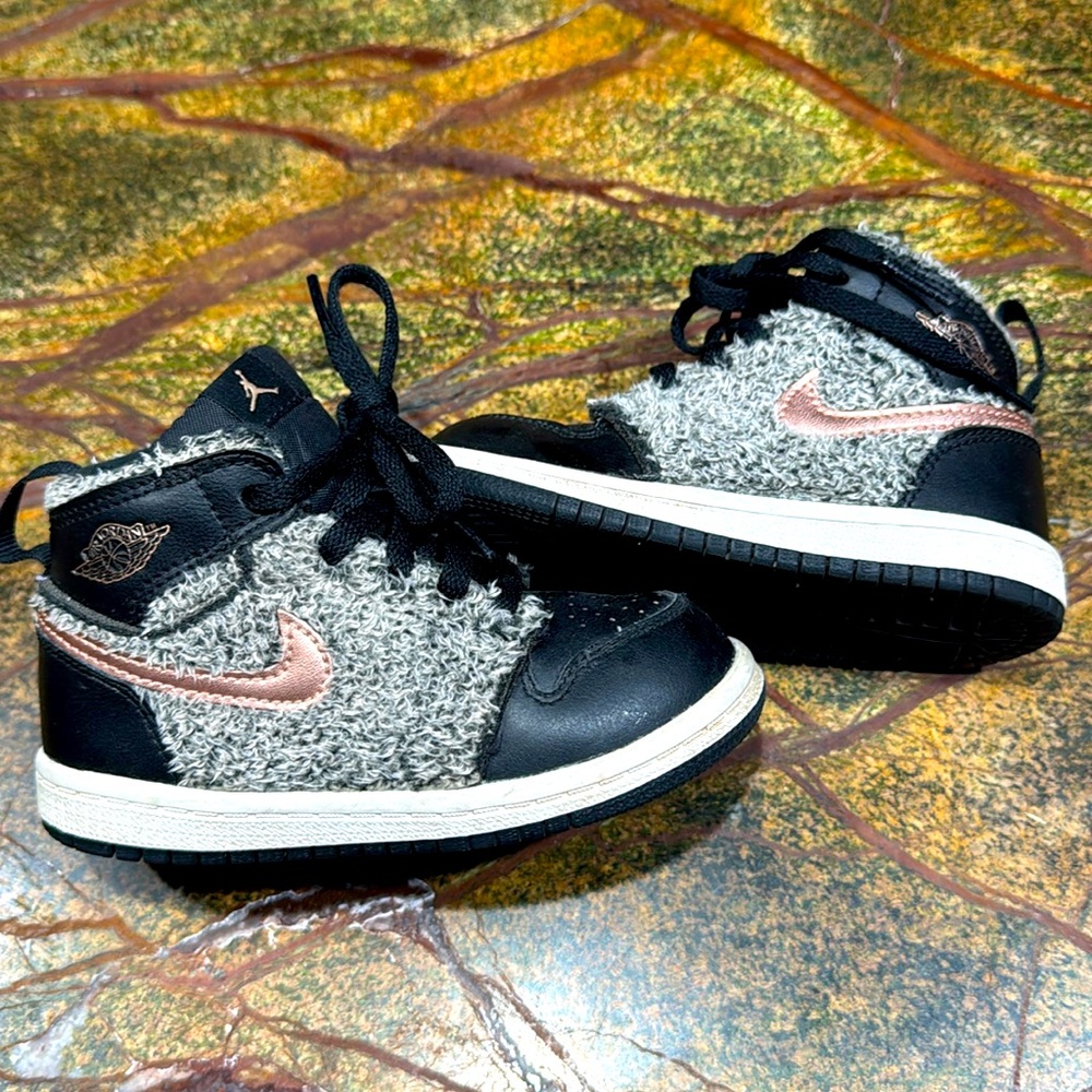 Jordan high top Nike shoes. Fuzzy with rose gold outlay and swish. Toddler 8T